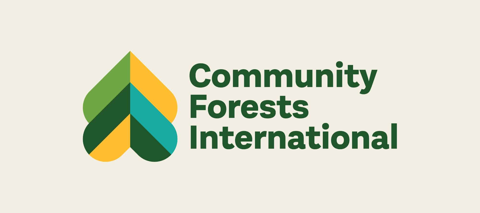 The nonprofit logo of Community Forests International, which looks like two upside-down hearts that create a tree shape.